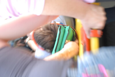EMT students practicing extrication from vehicle using a KED and backboard